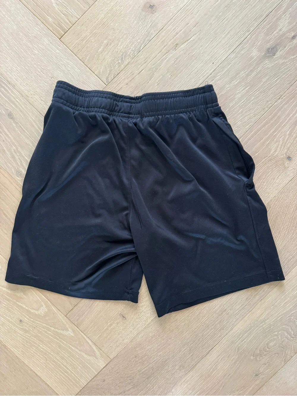 2 pairs of Under Armour Boy's Performance Shorts - 1 black/ 1 navy blue- youth m